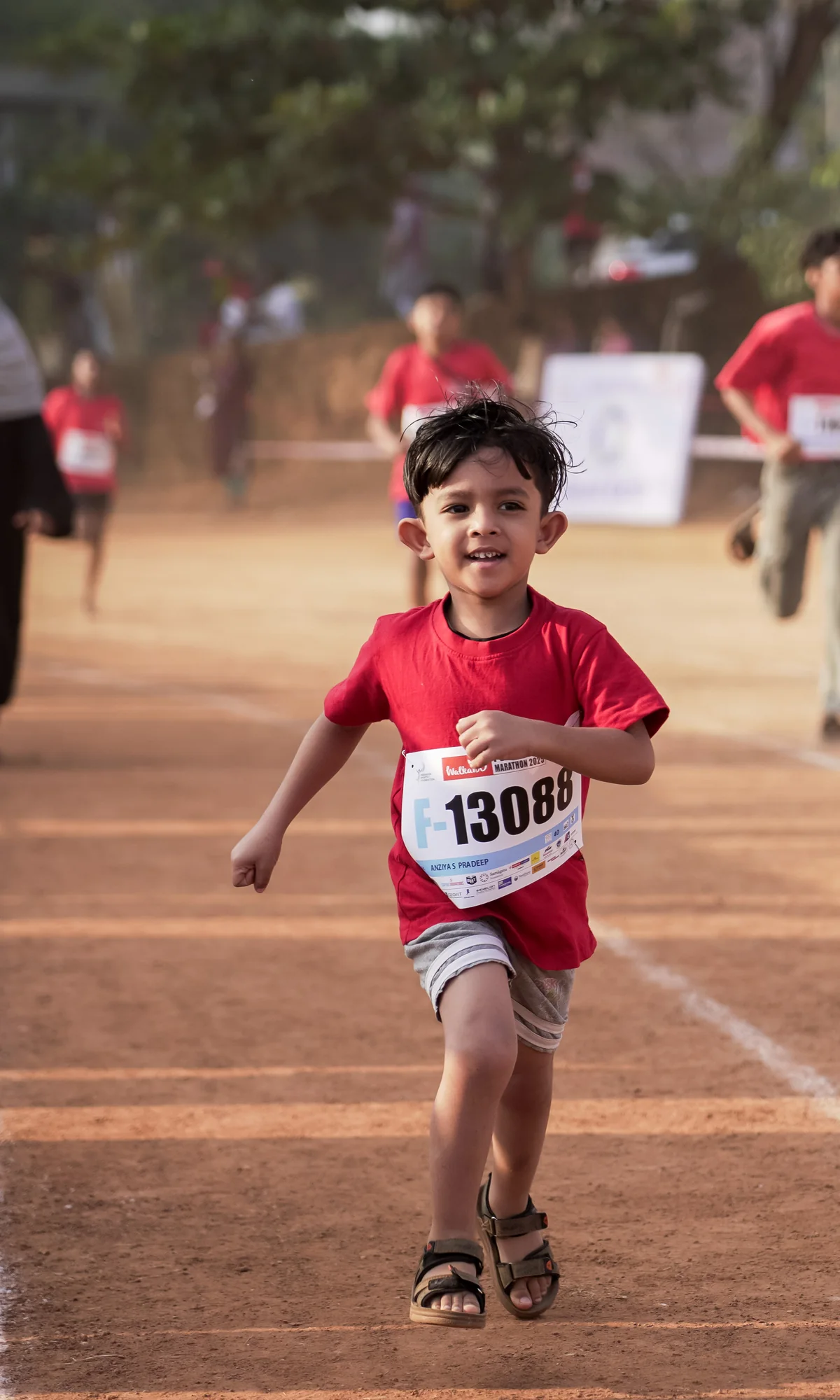 Young child running at the Peravoor Marathon